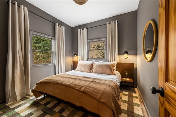 Cozy king bedroom with smart TV and a large closet—one of three king rooms, making it easy for multiple families or couples to stay comfortably.