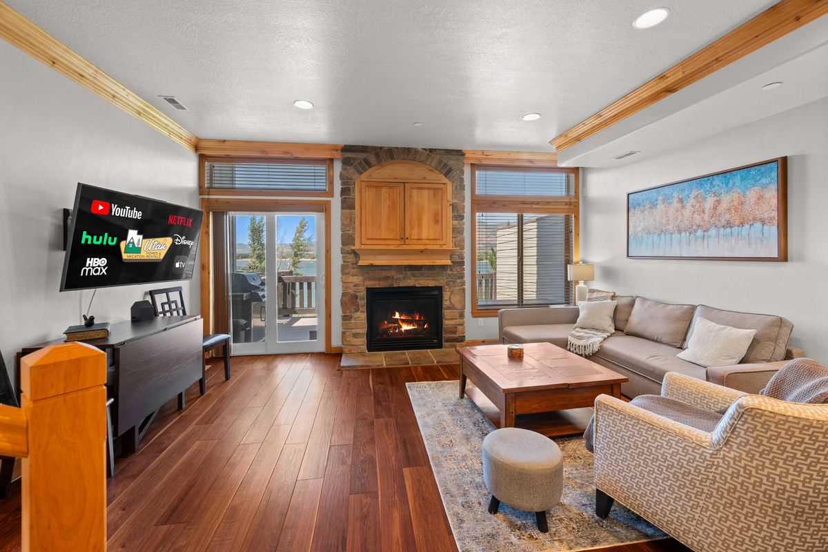 Relax by the fireplace while enjoying sweeping reservoir views from the open-concept living area.