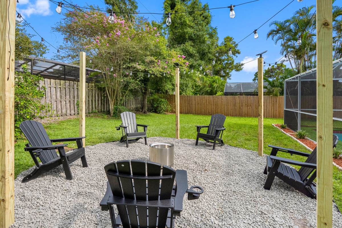 With Adirondack chairs, flickering flames, and ambient lighting, this backyard fire pit transforms nights into something magical.