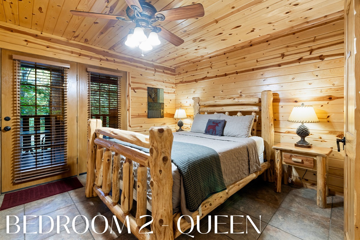 Bedroom 2 with a queen bed and log-style furniture.