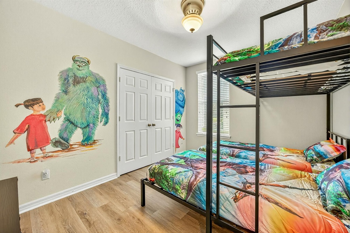 Kids’ bedroom with fun themed décor and twin-over-twin bunk beds.
