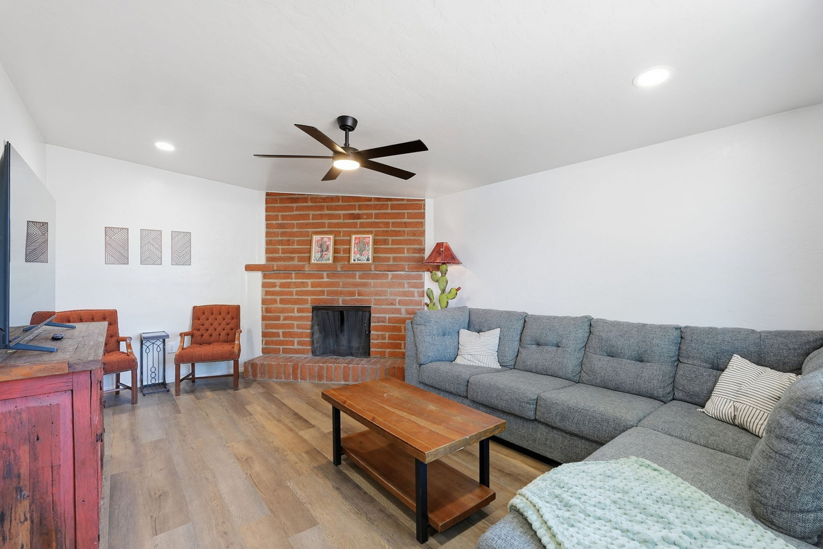 Heart of the Home: Living room designed with guest comfort in mind. It features a comfortable sofa, accent seating, and a smart TV-perfect for streaming your favorite movies.  *Note - Fireplace is decorative only - cannot be used.