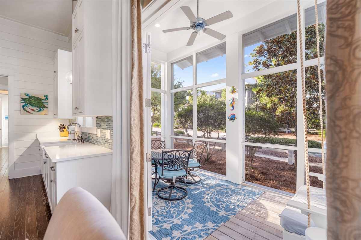 A screened in porch off the kitchen for breakfast or a morning swing. 