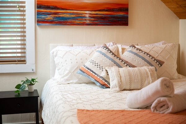 Embrace tranquility in our cozy bedroom with a plush queen-sized bed. Serenity and peaceful dreams await!