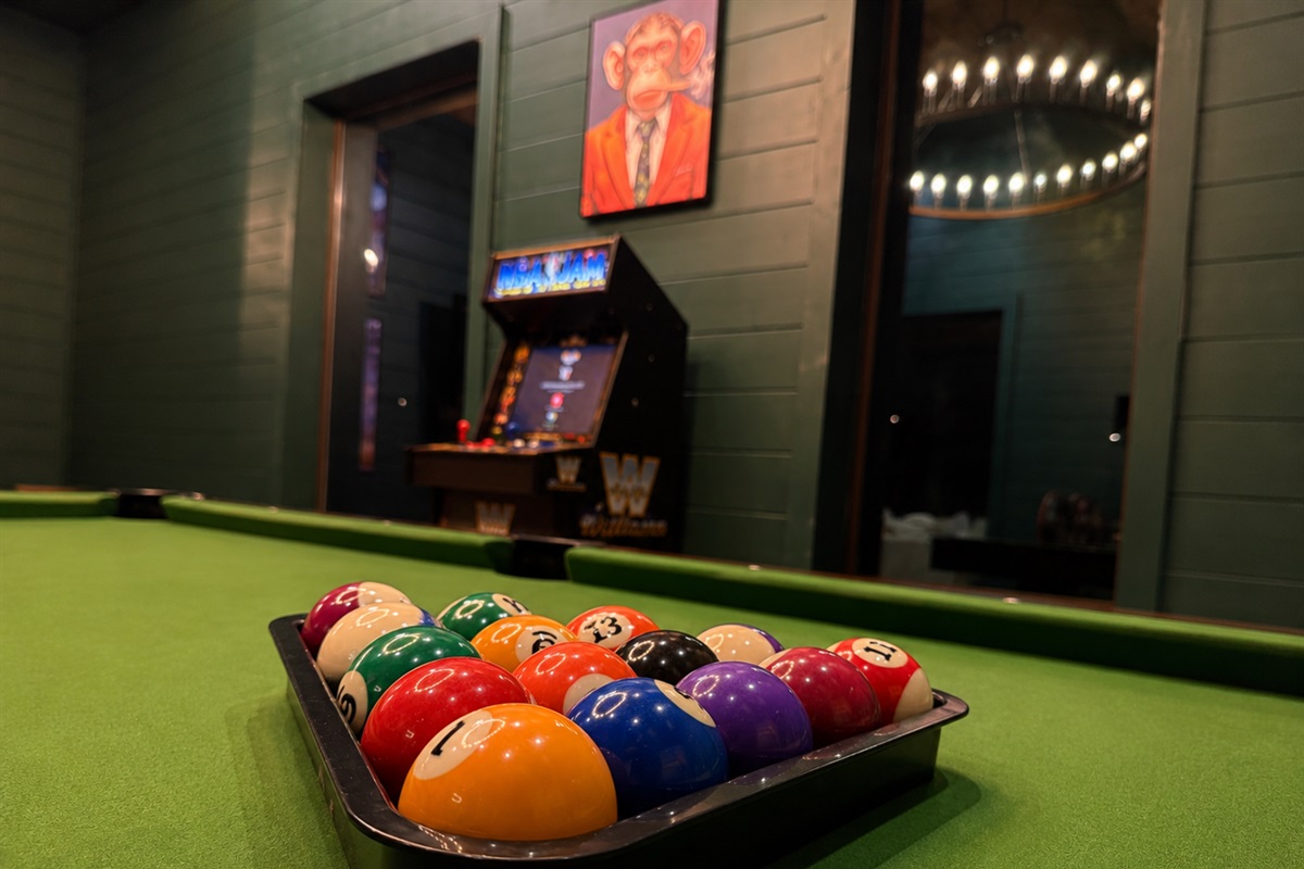 Game Room: Enjoy friendly competition with pool, arcade fun, and vibrant decor for unforgettable nights!