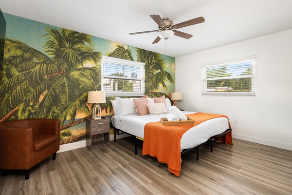 The Orange Room (primary bedroom) has a spacious king bedroom. Golden hour hits different when your whole room feels like sunset. 🧡 Start your morning with palm trees and end it in paradise.