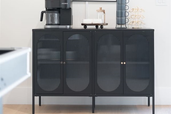 Coffee-inspired wall art adds a cozy touch to the café corner.