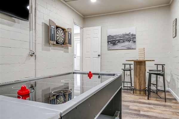 Air hockey table with plenty of space to compete, relax, and unwind