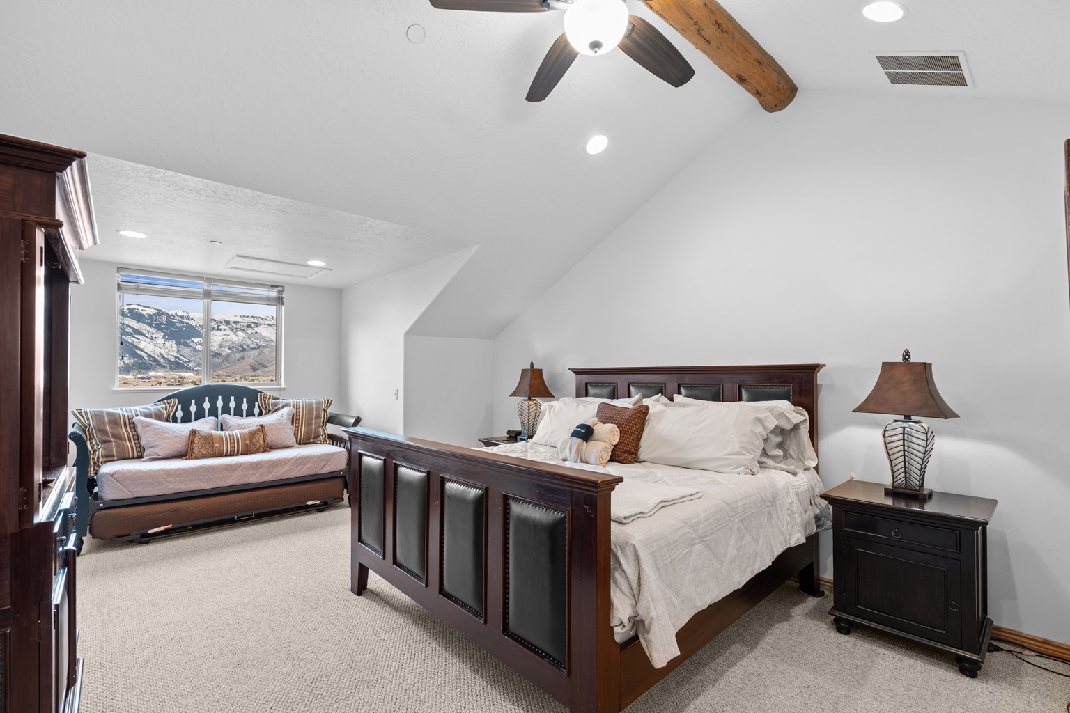 Bright and airy primary suite offering beautiful natural light and calming views to start and end your day.