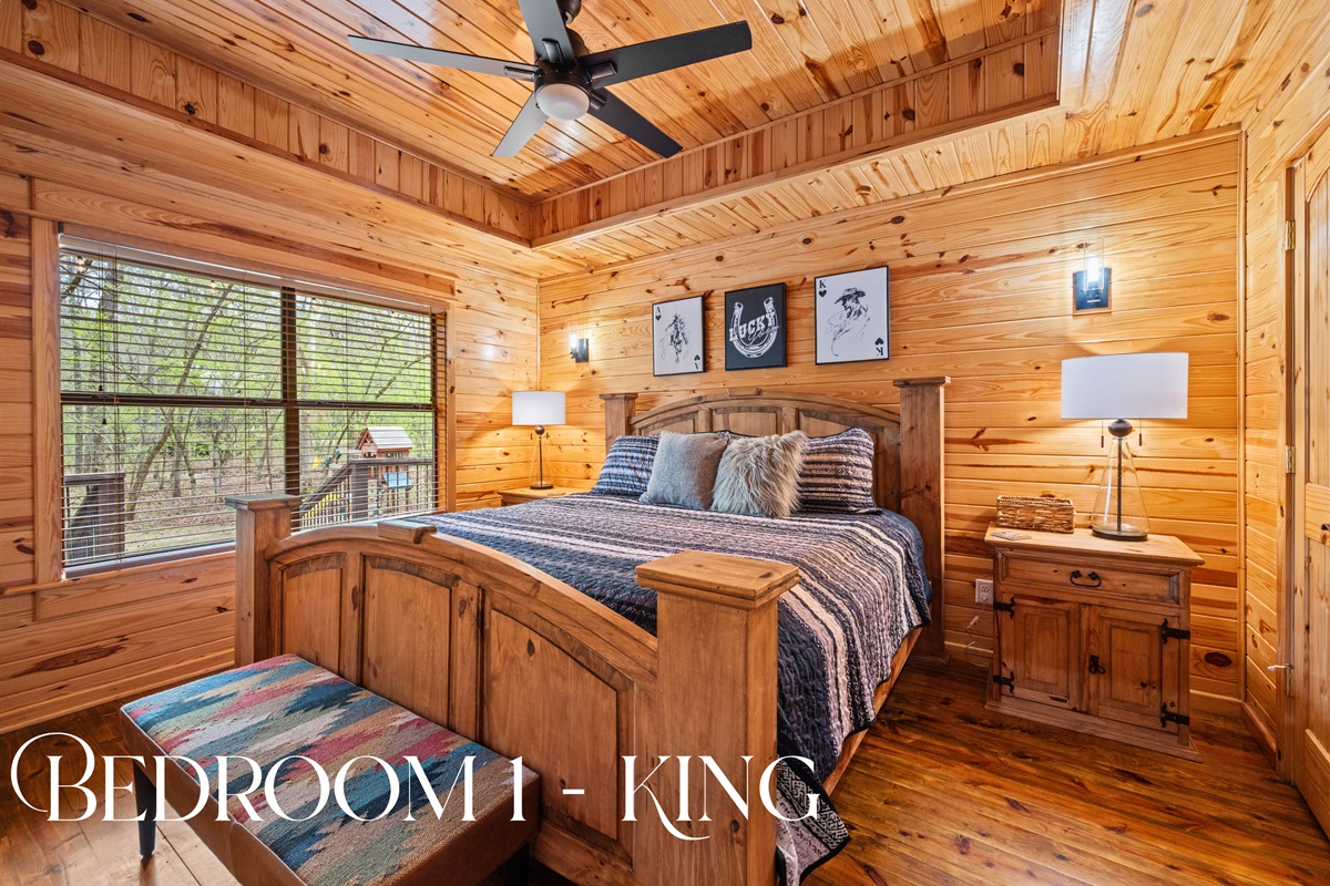 A king bed anchors the first bedroom, offering a quiet and comfortable space designed for restful nights.