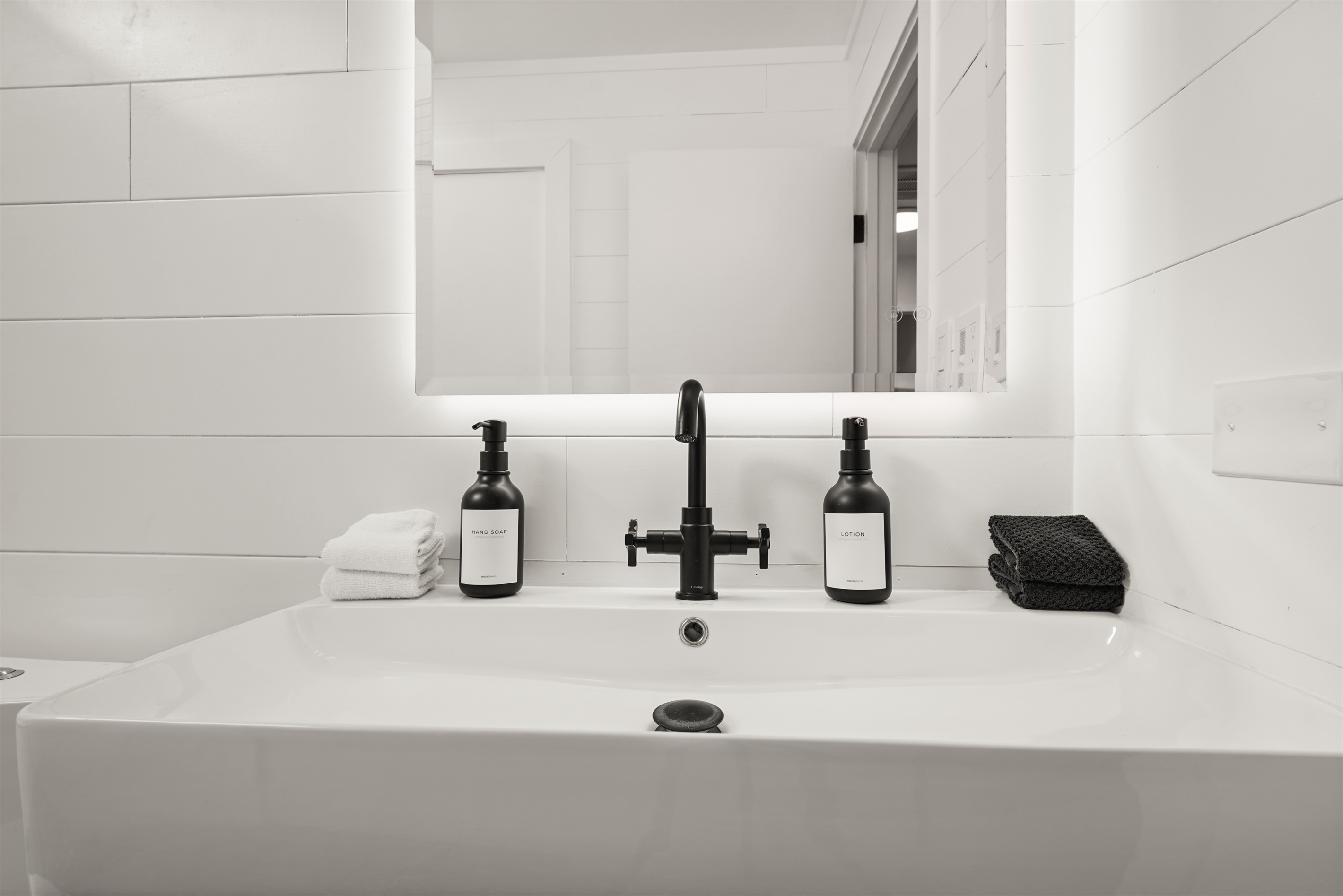 Well-appointed bathroom with a combination bathtub and walk-in shower, perfect for both a relaxing soak and a refreshing start to the day.