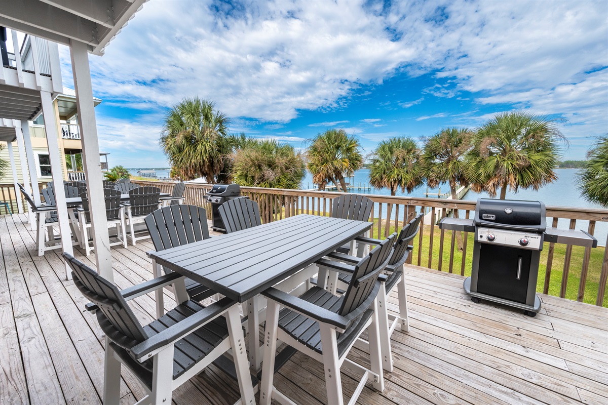 Lakeside paradise: cozy deck perfect for BBQs, gatherings, and serene water views.