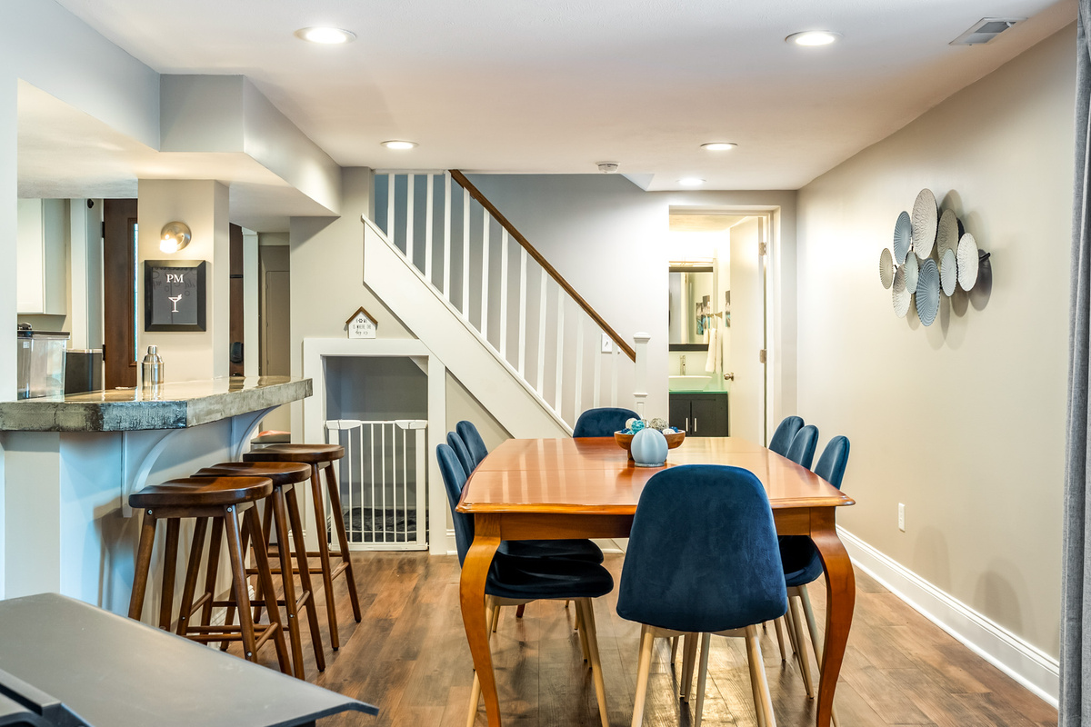 Truly dog-friendly! This multi-use dining space features table seating, a raised breakfast bar, and a stylish, integrated pet crate so your four-legged family member feels right at home.