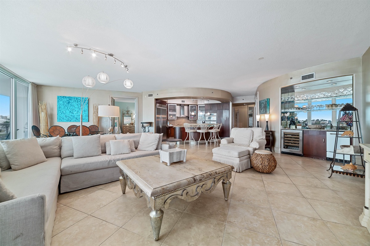 This thoughtfully designed living space maximizes natural light and integrates seamlessly with the surrounding environment. The open-concept layout and expansive windows create a bright and airy atmosphere.