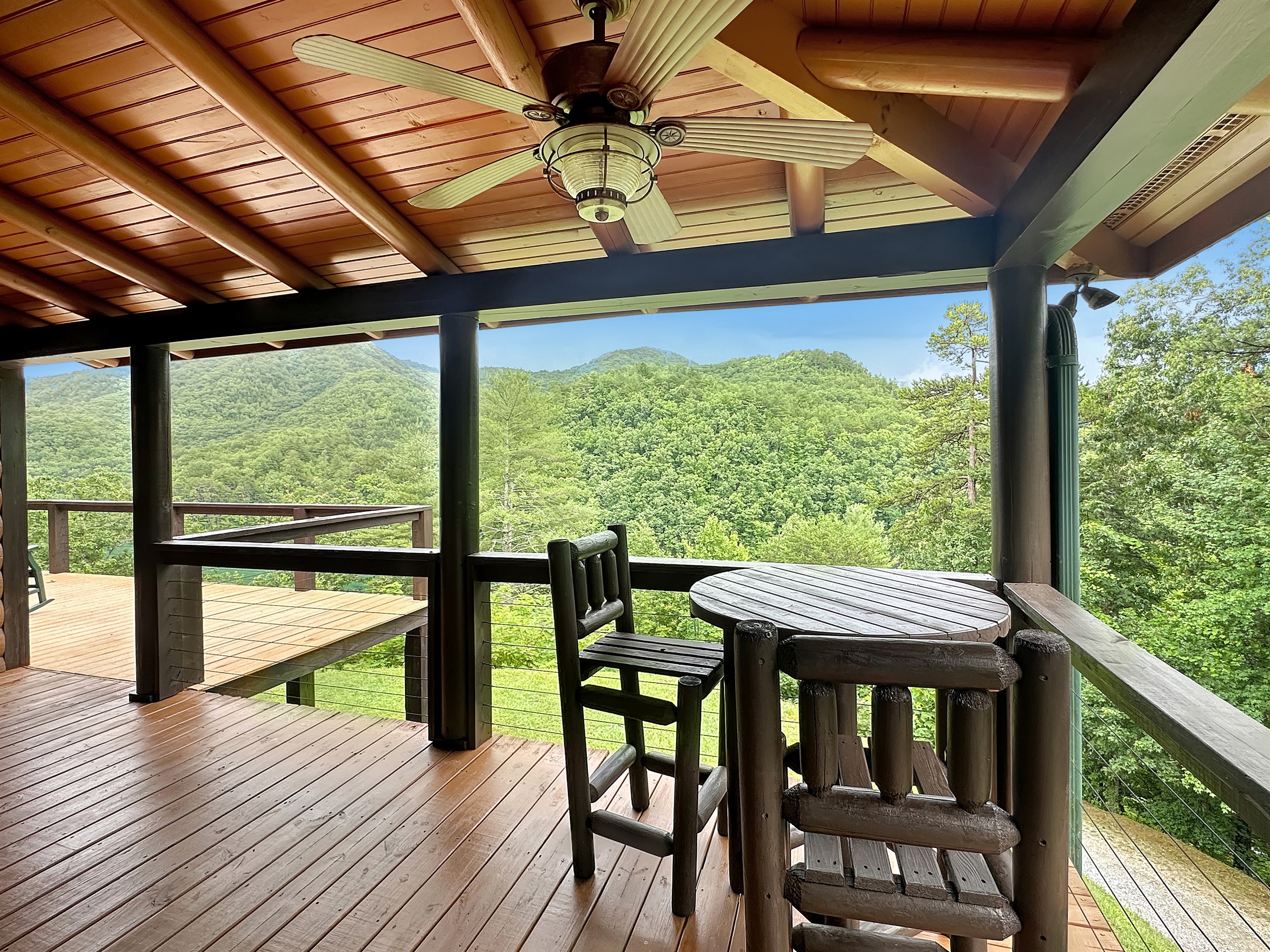Covered Porch: Unwind with breathtaking mountain views from this charming outdoor retreat!