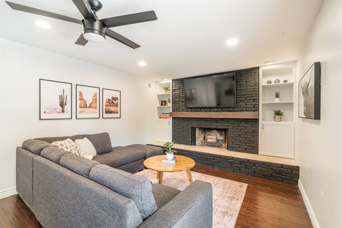 Family room is so comfortable! With a fireplace,  large flat screen TV, and our provided board games, you'll have no trouble settling right in! *Sectional has a QUEEN SOFA BED