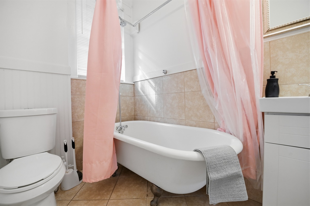 Full bathroom with shower and tub