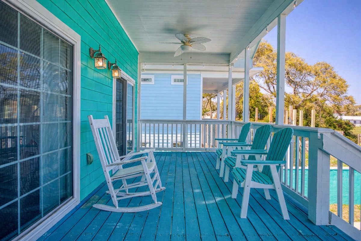 Sit and enjoy company in the custom seating on the upper deck out back.