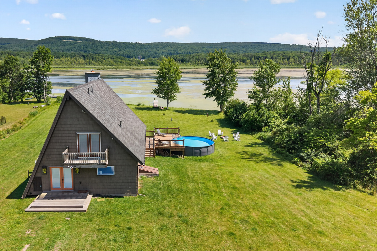 Aerial view of the home and pool