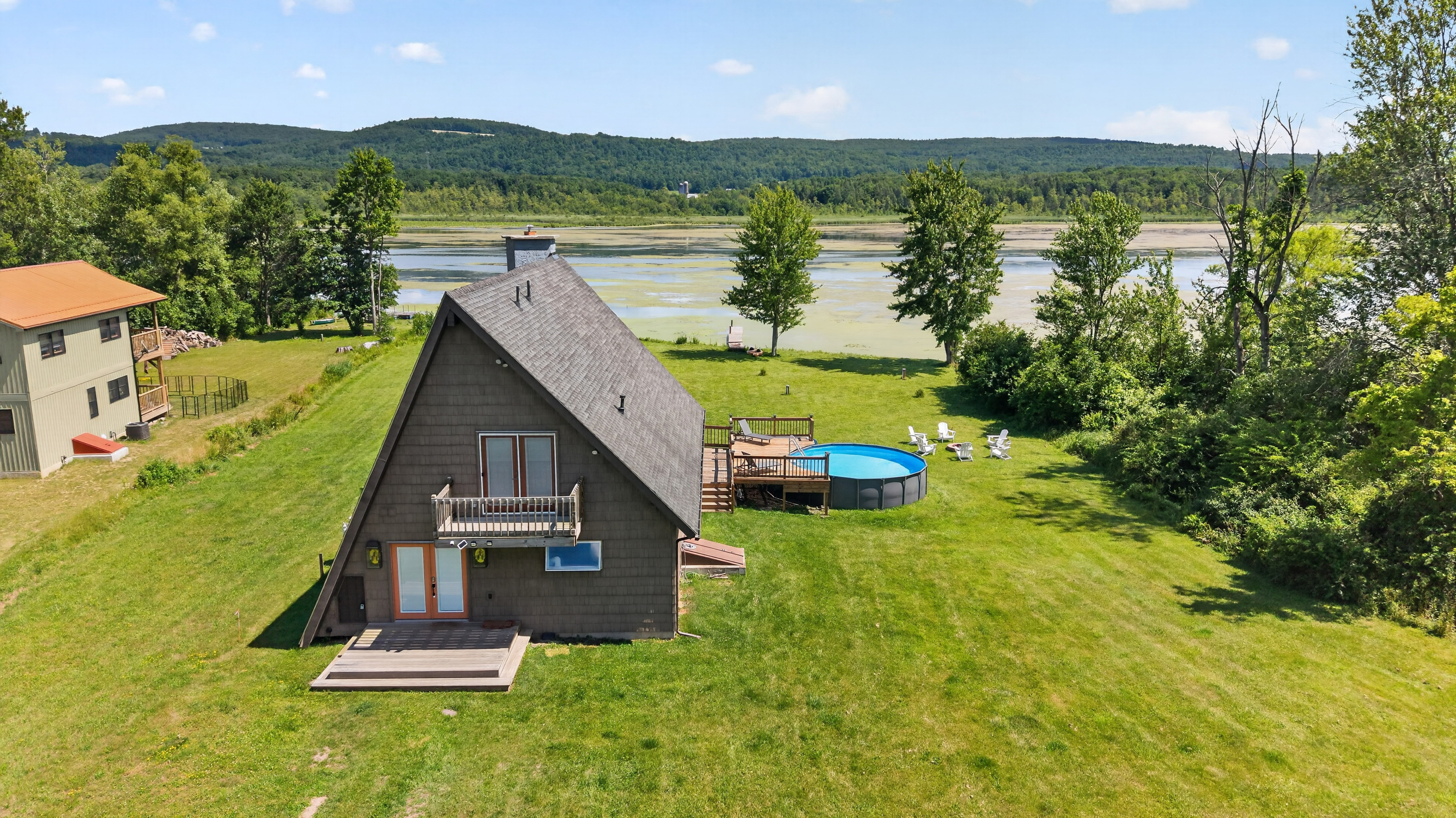 Aerial view of the home and pool