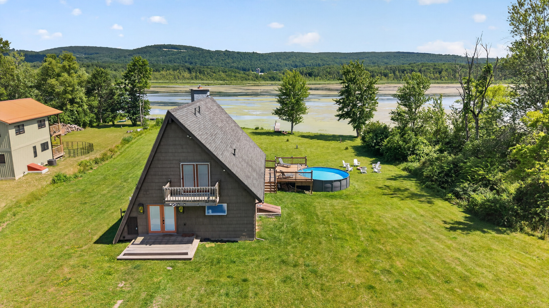 Aerial view of the home and pool