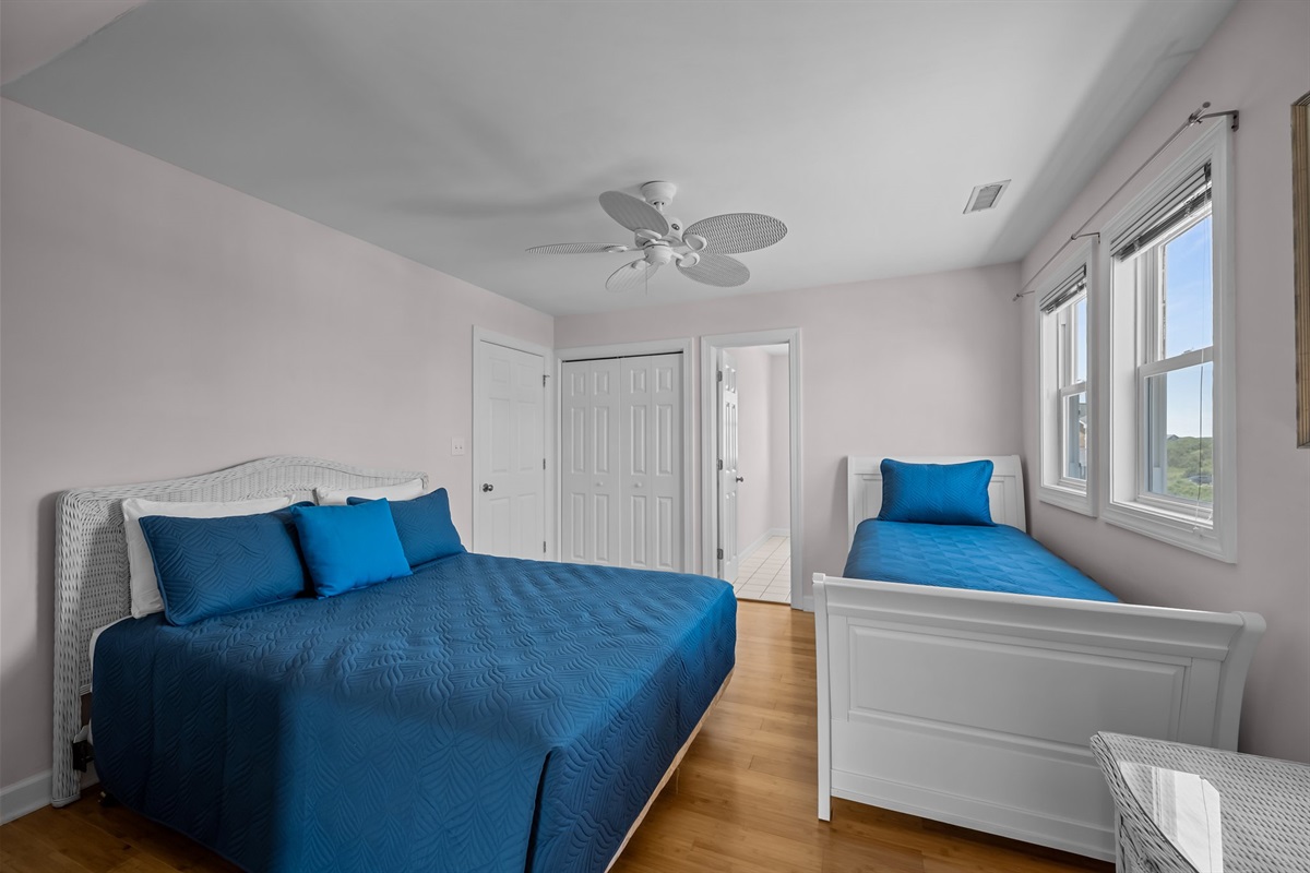 Queen and twin-size beds in 2nd-floor bedroom 1