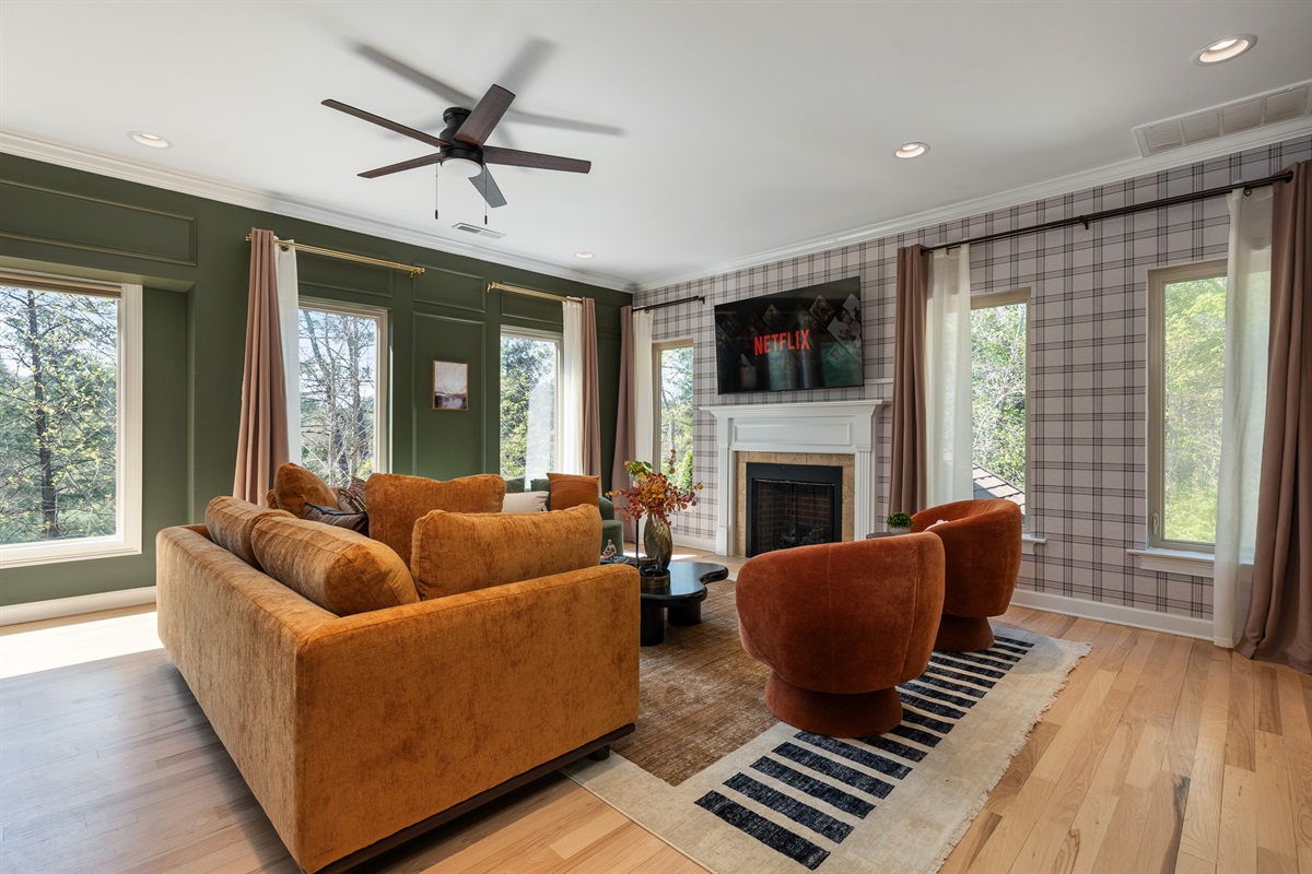 Spacious main living room with fireplace and seating for the whole group - built for gathering comfortably