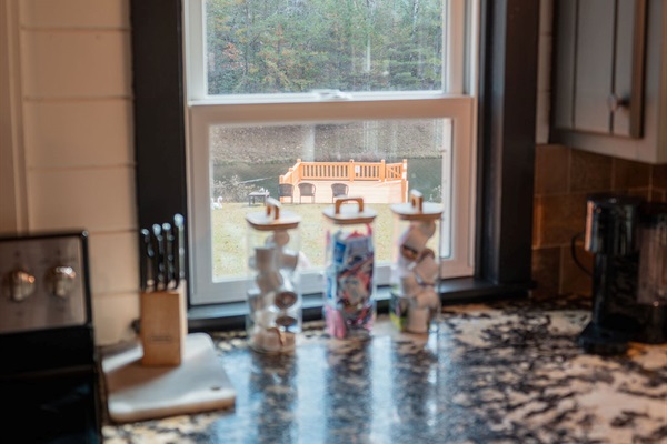 Cook with a view &mdash; the pond glimmers just beyond the window, inviting calm into every moment.