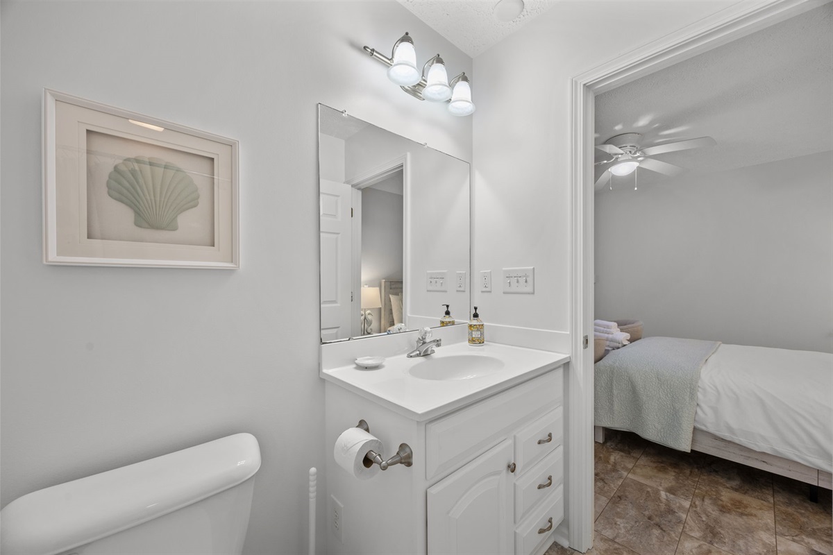 Ground-level full bathroom, conveniently located next to the bedroom
