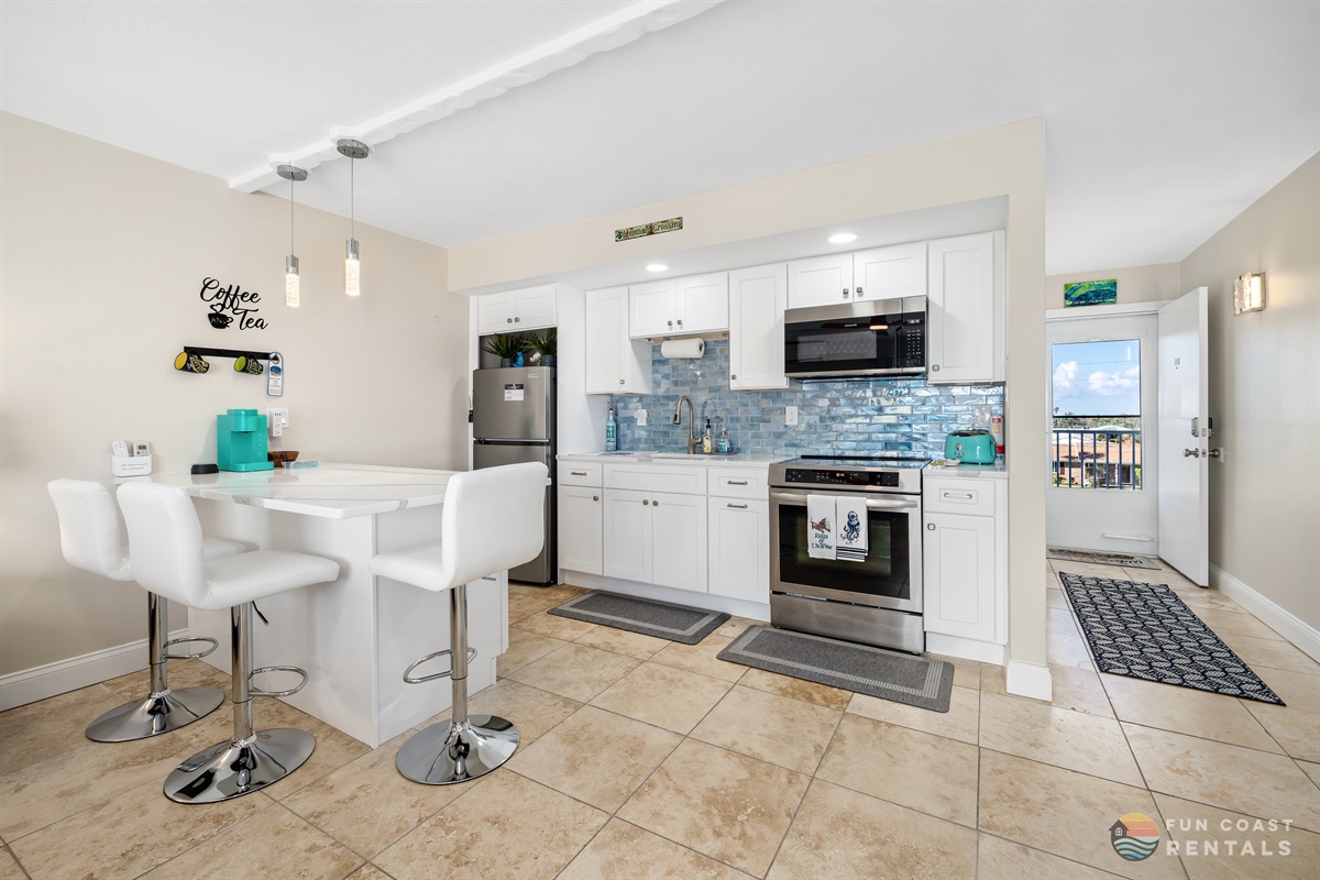Modern Stainless Steel Kitchen with Island Dining