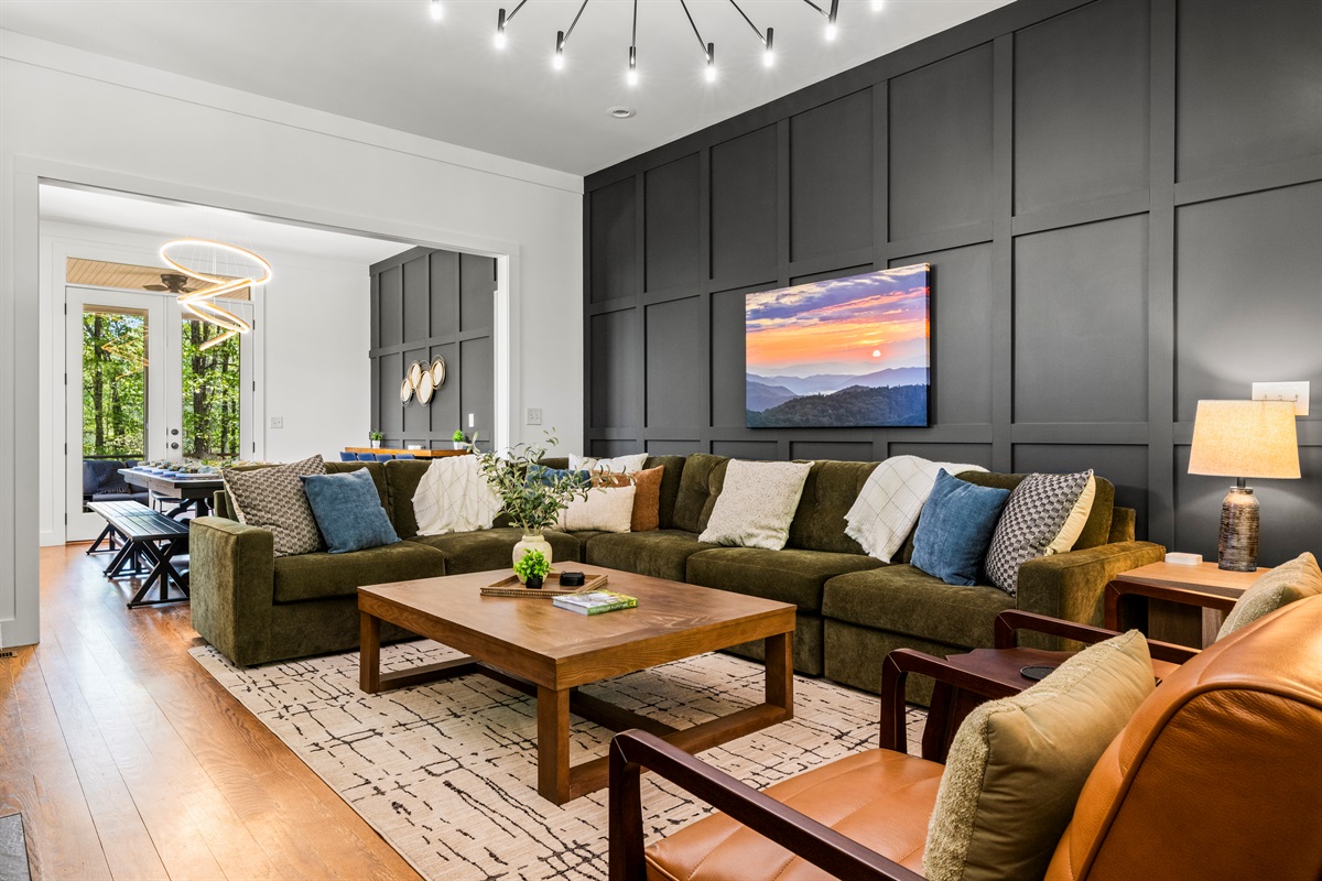 This spacious open-concept living room flows seamlessly into the dining space, creating a bright, stylish hub for laughter, late-night games, and making memories together.