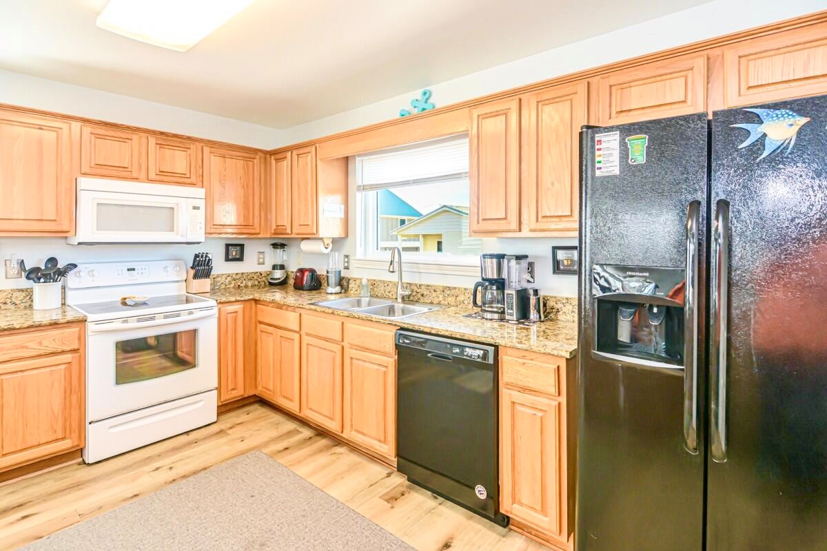 A fully equipped kitchen ready for home-cooked meals or quick beach snacks