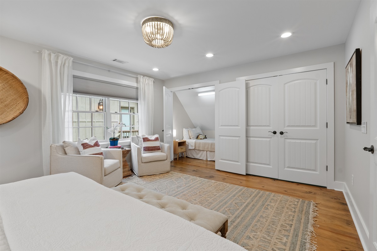 The second bedroom features a charming twin bed nook, perfect for kids or additional guests.
