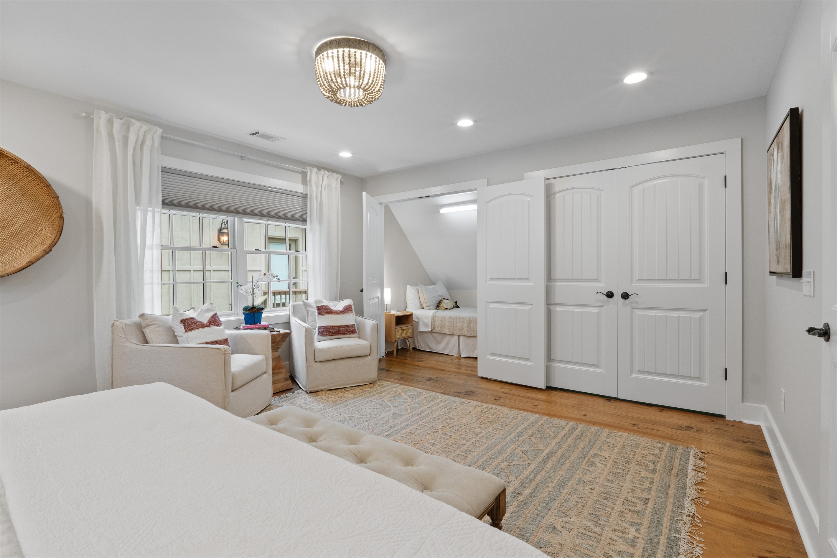 The second bedroom features a charming twin bed nook, perfect for kids or additional guests.
