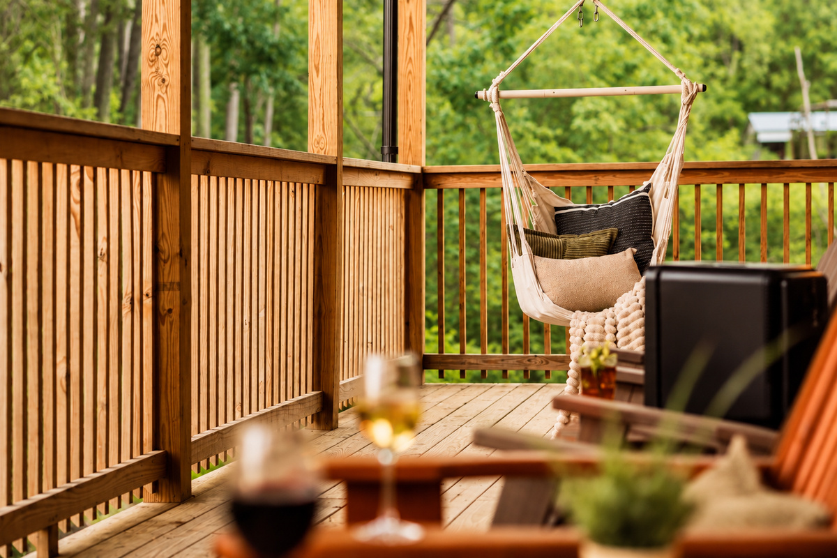 Curl up in the swinging rope seat with a pile of pillows and leaves rustling.