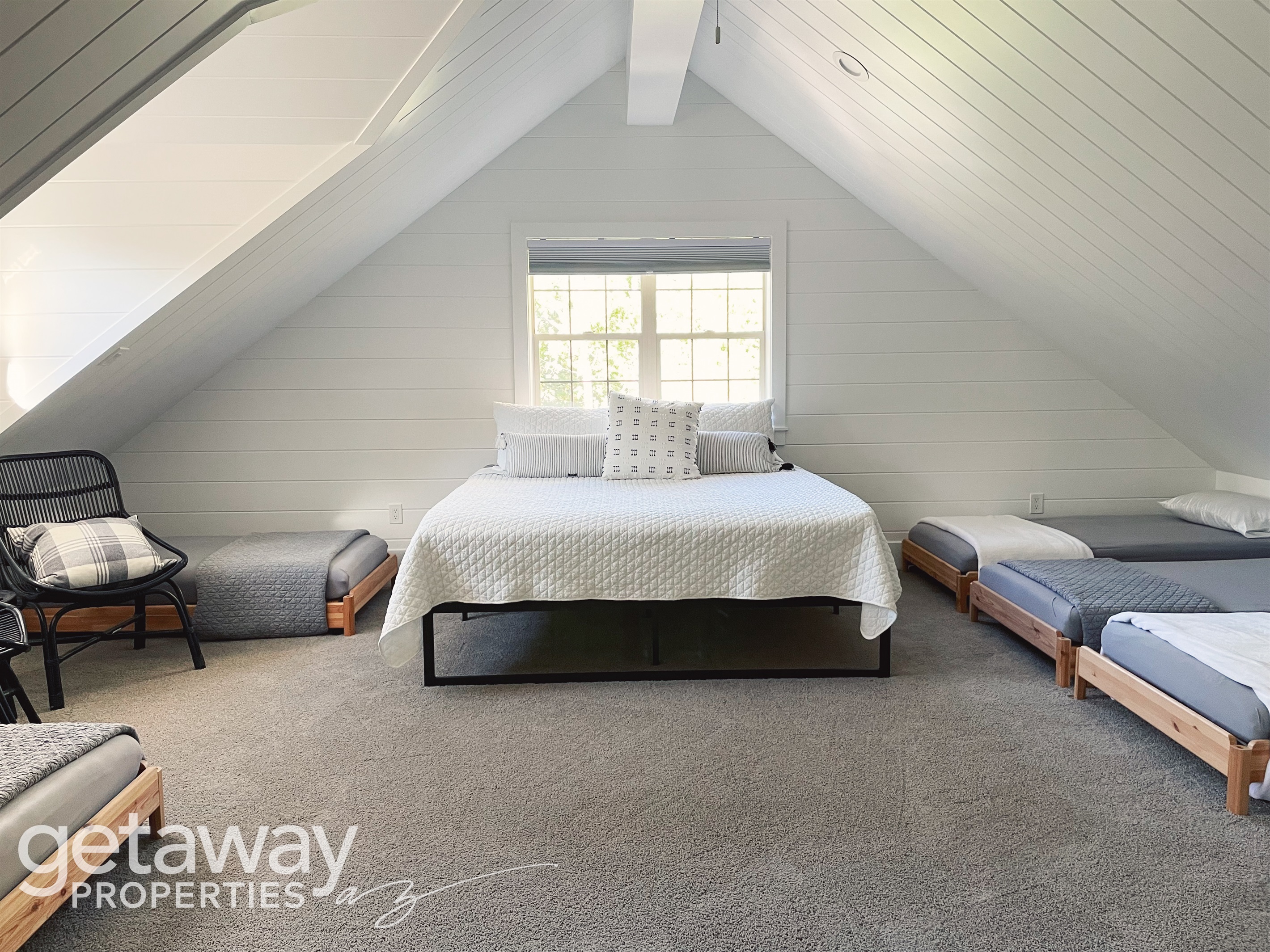 upstairs room with king bed and twins