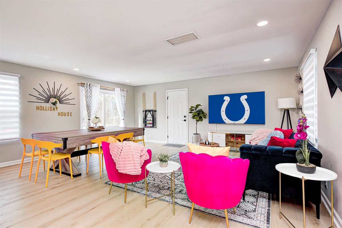 Bright and spacious living room designed for gathering — movie nights, game nights, and relaxed downtime.