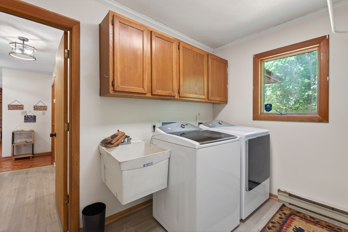 Laundry Room: Bright space with modern machines and a view, perfect for keeping your gear fresh!