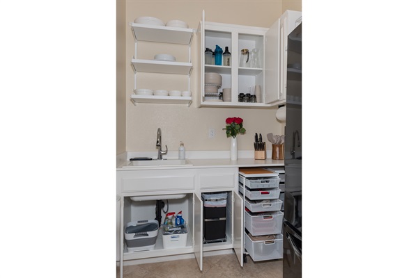 Open shelving with plates, bowls, and kitchen essentials