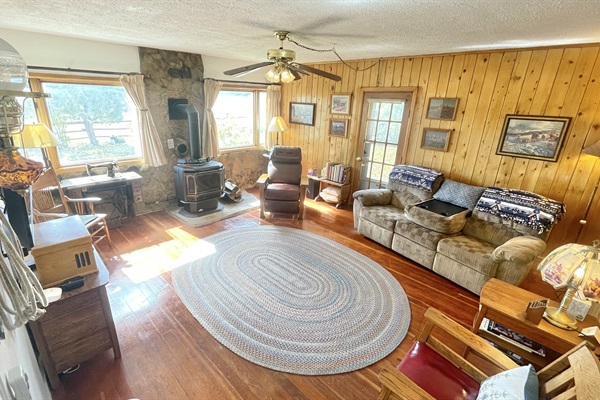 Family room, propane stove heater, antique train & treadle sewing machine.