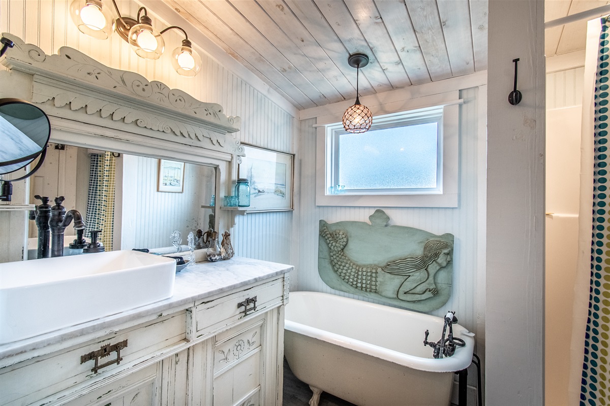 Bathroom with claw foot tub and small shower