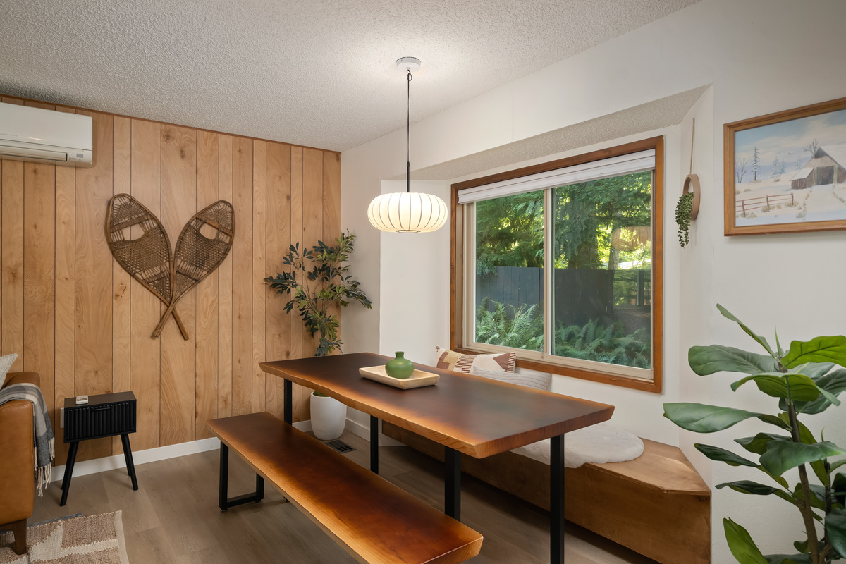 Warm lantern light and forest views make every meal here feel special.