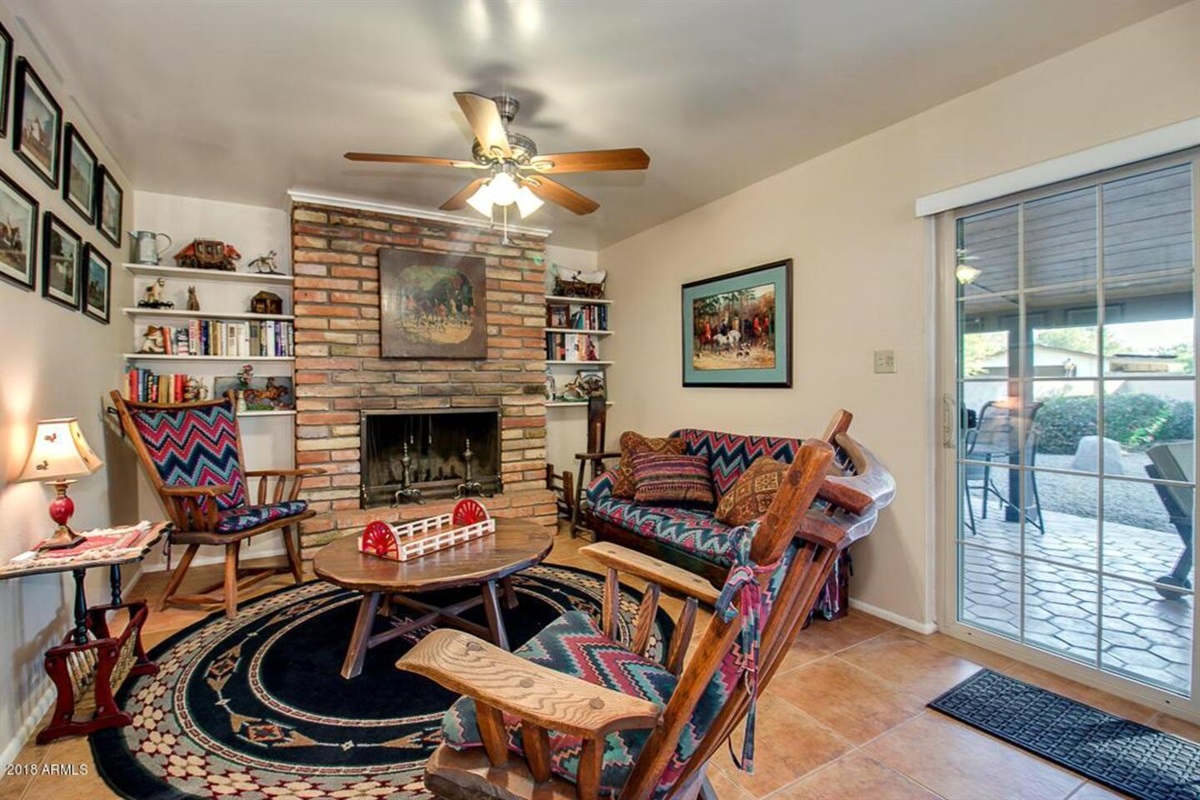 Family room with fireplace with an electric wood insert. Can be switched to wood burning if desired. 