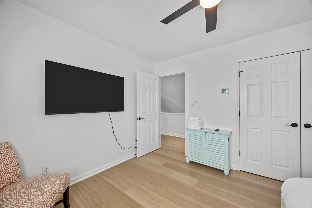 Perfect kids room with bunk beds, TV, and space to relax after a day at the beach