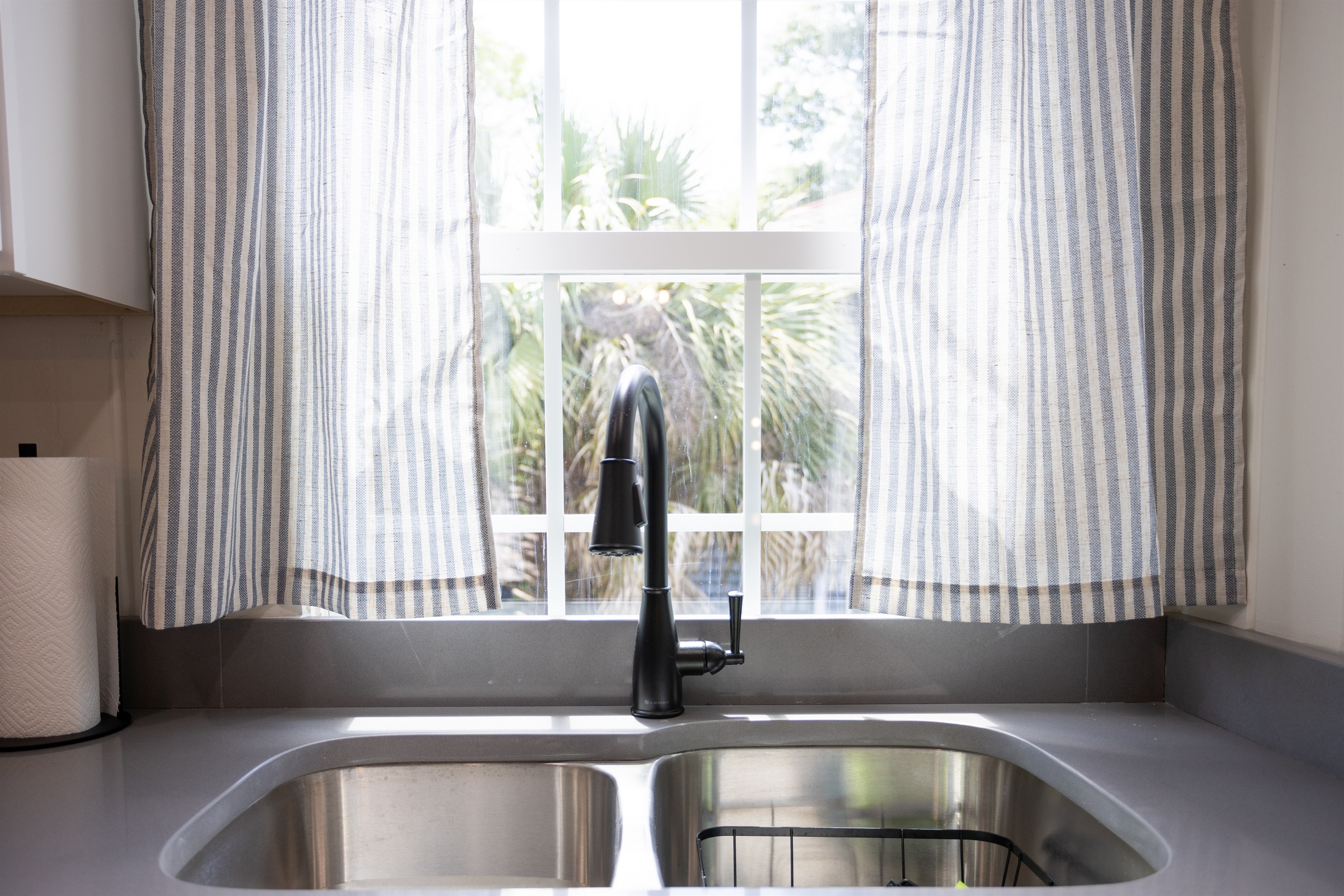 A sunny window over the sink brings in natural light and a touch of charm to your daily routine.