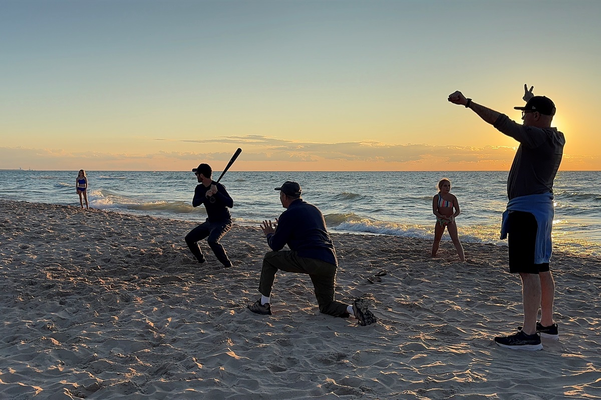 Baseball on the beach at sunset? Perfect.