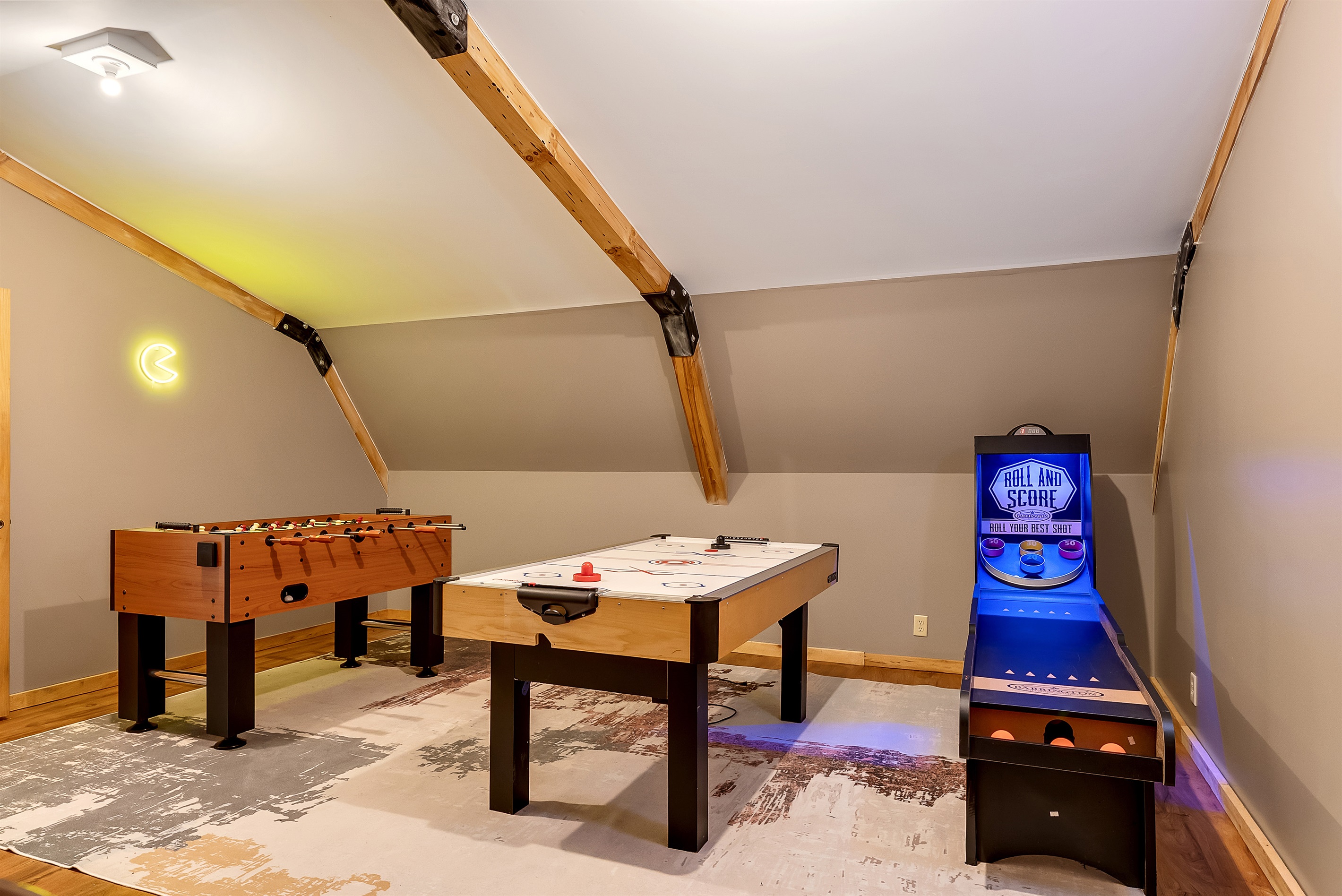 Game room with Skee-Ball, Foosball, Air hockey, Pac-Man arcade game & Final Fight arcade game.
