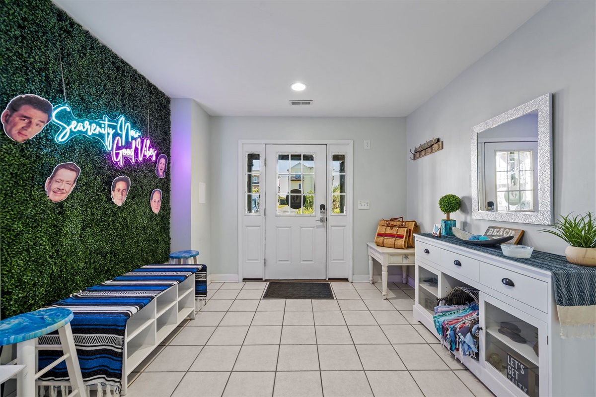 Our beach-ready entryway has hooks for all your gear, a shoe rack to corral the chaos, and a mirror.