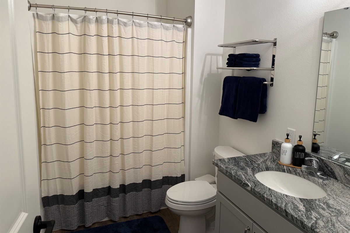 Bathroom #2 has shower tub combination. Towels are provided and easily reached.
