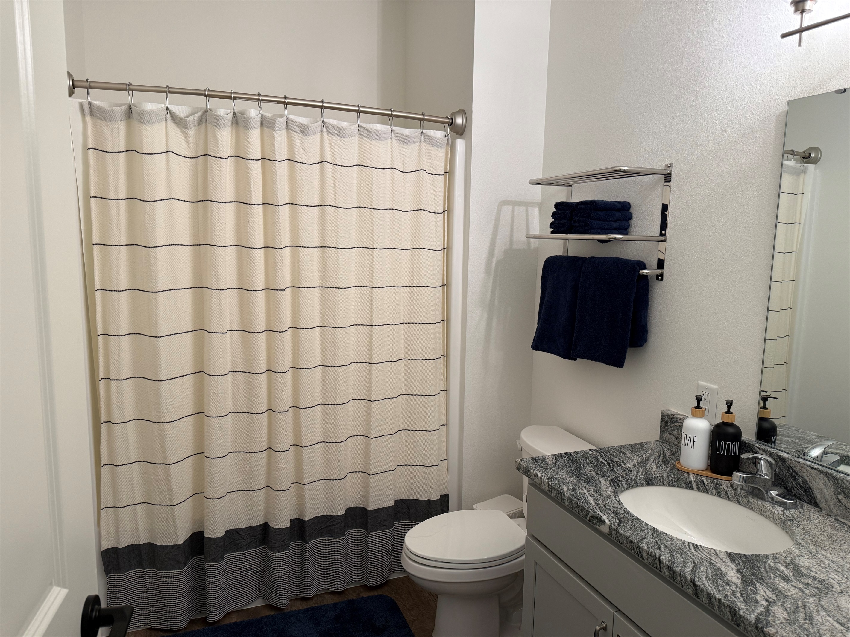Bathroom #2 has shower tub combination. Towels are provided and easily reached.